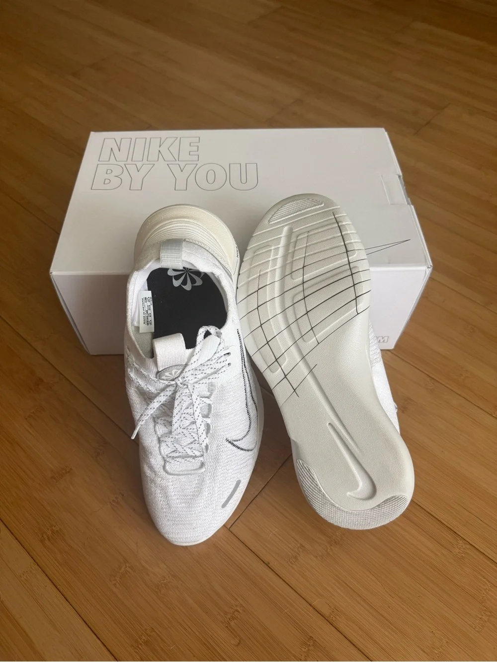 Nike Men’s White and Black Swoosh Free RN Lightweight Sneakers